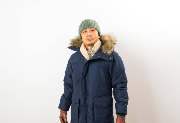 istock Handsome asian man dressed with winter clothing 1285246763