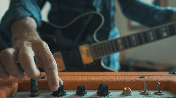 istock Rock guitarist playing guitar at home, pump volume up 1285246812