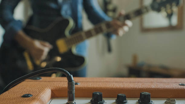 istock Rock guitarist playing guitar at home, alone during Covid-19 lockdown 1285246820
