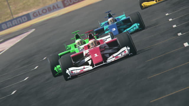 Multiple open-wheel single-seater car race cars driving across finish line