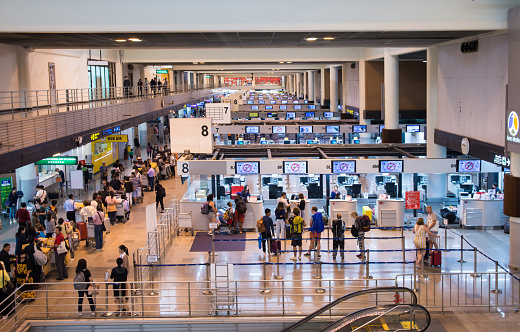 Bangkok,Thailand - Oct 29,2019 : Passengers are queuing to check in at the counter in Don Mueang International Airport.The airport is considered to be one of the world's oldest operating airport.