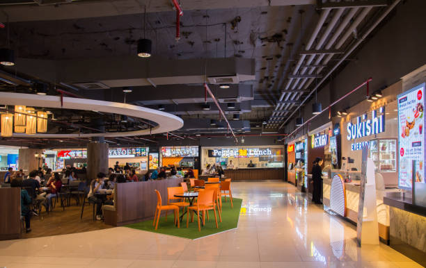 Food court at Don Mueang International Airport. Bangkok,Thailand - Oct 29,2019 : People can seen having their meal in the food court at Don Mueang International Airport.The airport is considered to be one of the world's oldest operating airport. food court photos stock pictures, royalty-free photos & images