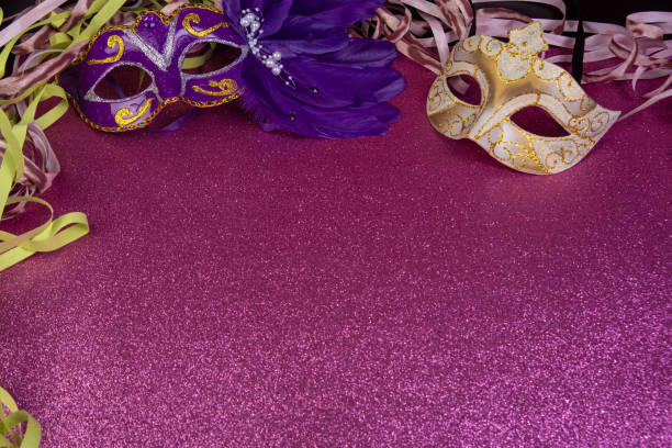 istock Carnival masks, Venetian masks on shiny surface with streamers, selective focus. 1285249442