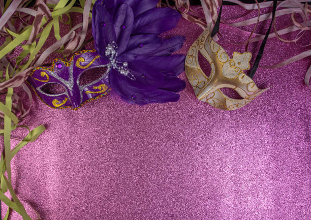 istock Carnival masks, Venetian masks on shiny surface with streamers, selective focus. 1285249449