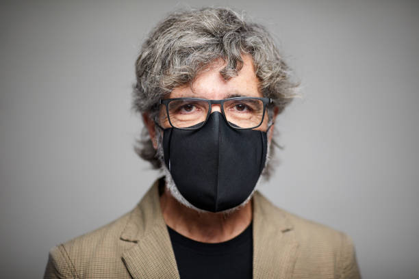 istock One senior man wearing a protective mask. 1285253656