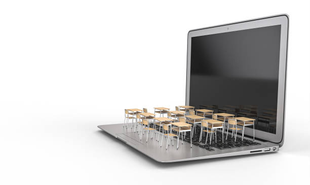 istock school desks on a laptop keyboard. distance teaching concept 1285253716