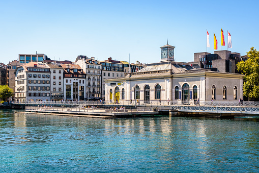 Geneva, Switzerland - September 4, 2020: General view of the Pont de la Machine and Arcades des Arts, a former pumping station on the Rhone river converted into an exhibition hall.