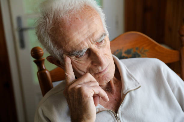 Old man sitting on rocking chair