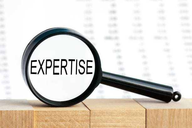 istock Look closely and Expertise with a magnifying glass, business concept image with soft focus background 1285255032
