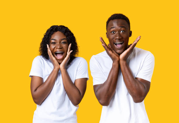 istock Surprised black couple screaming and touching their faces 1285255108