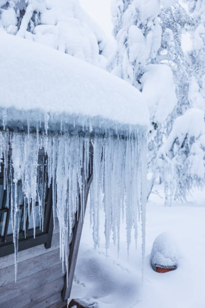 istock Ice stalactites hanging from the roof on cold weather 1285259090