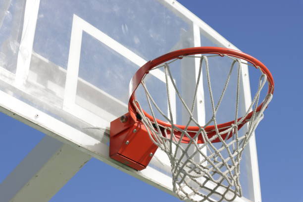 istock basketball hoop with blue sky in the background 1285259550