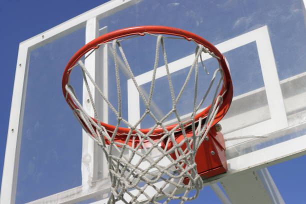 istock basketball hoop with blue sky in the background 1285259552