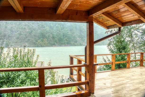 istock Heavy pouring rain over mountain lake 1285259595