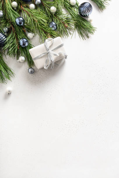 istock Christmas gift, fir branches on white. Xmas greeting card with copy space. 1285259637
