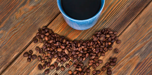 istock Cup of black coffee with roasted coffee beans 1285262546