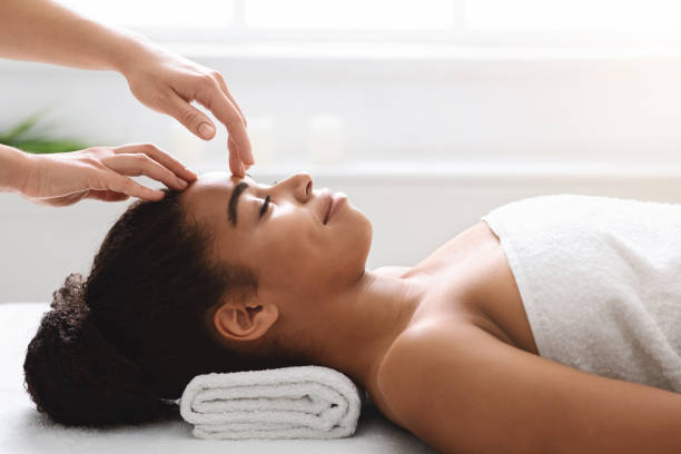 istock Spa therapist making relaxing head massage for young beautiful lady 1285263438