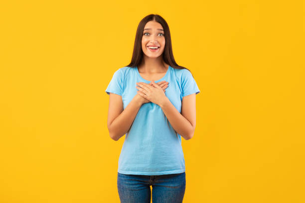 istock Impressed woman keeping her hands on chest 1285263482
