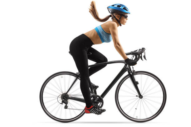istock Young female cyclis riding a bicycle with a blue helmet 1285265277