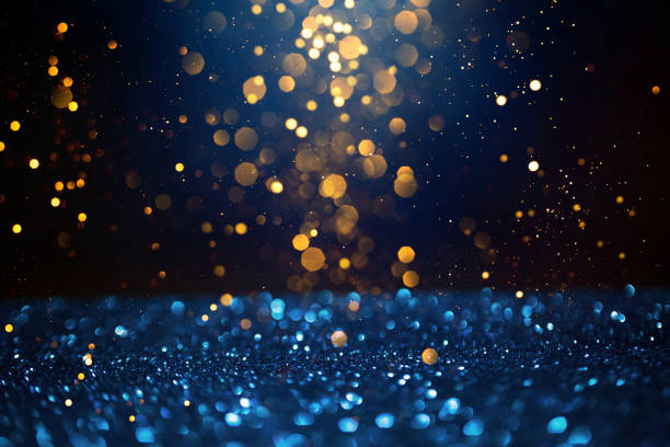istock Golden abstract bokeh on dark blue background. 1285265353