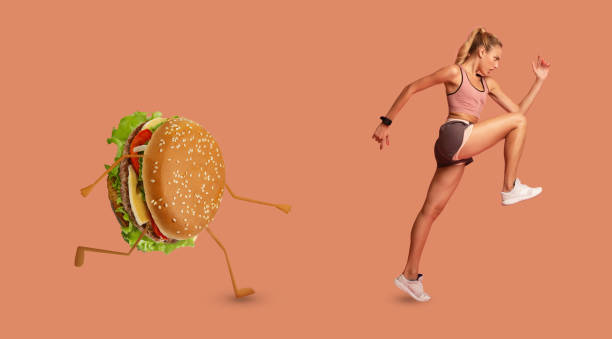 istock Lady Running Away From Burger Exercising Over Pink Background, Panorama 1285265482