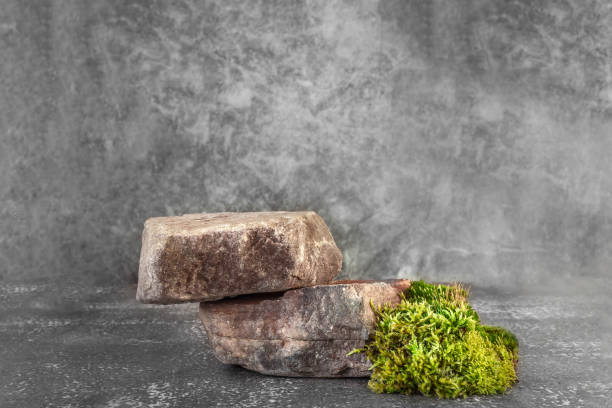 istock Natural stone stand for presentation and exhibitions on dark background. Abstract podium for organic cosmetic products. Minimal style. 1285266864