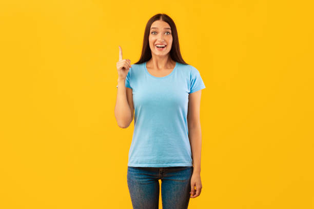 istock Excited woman having great idea and pointing up 1285267325