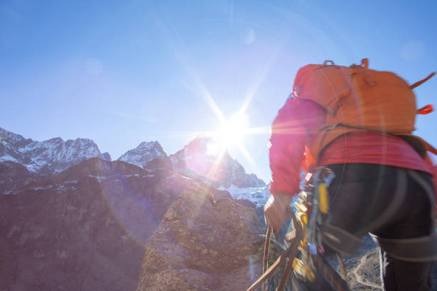 istock Mountaineer reaches summit of high pinnacle 1285268268