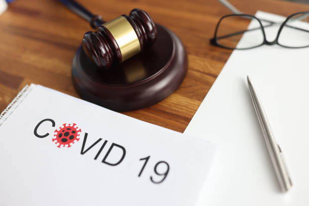 istock Judges gavel and legal documents lying on table in courthouse closeup 1285268480