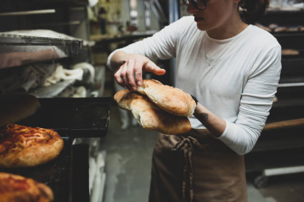 Midsection Of Woman Preparing Food At Store