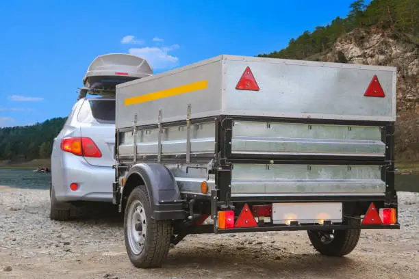 Car trailer and roof rack by the river