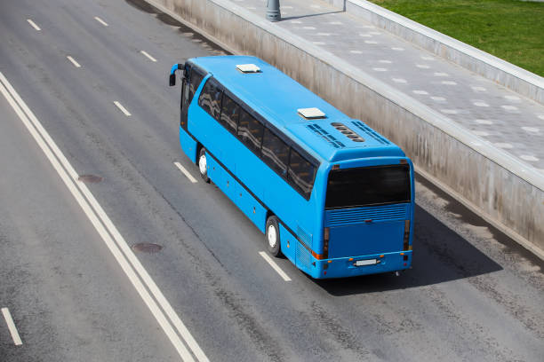 istock Tourist Bus Rides On a Highway 1285271695