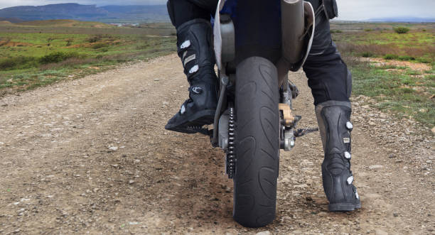 istock man on a motorcycle on a dirt road 1285274063