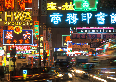 Hong Kong, China  Colourful neon lights and busy traffic, taxis and buses along Nathan Road, Kowloon.