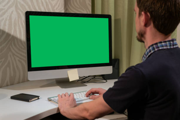 istock Freelancer works in front of a computer with a green screen 1285276005