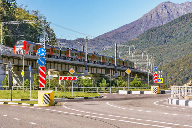 istock Passenger train from Sochi moves on the bridge.. Krasnaya Polyana. 1285277321