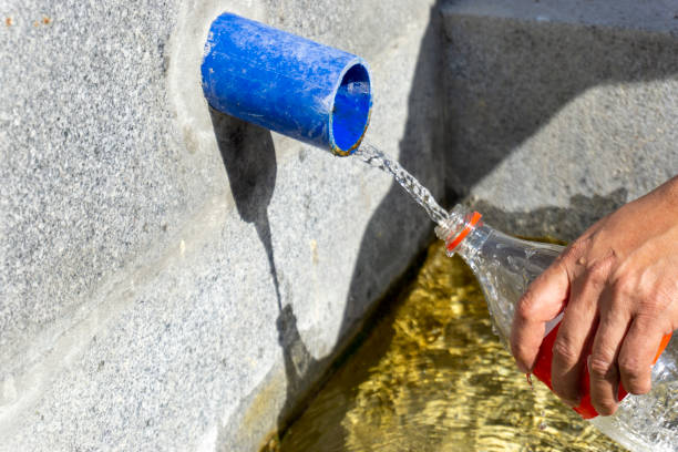 istock fills natural spring water into the bottle 1285279998