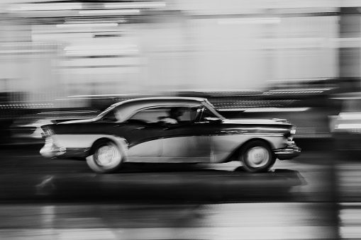 American classic car at night with motion blur in Havana, Cuba
