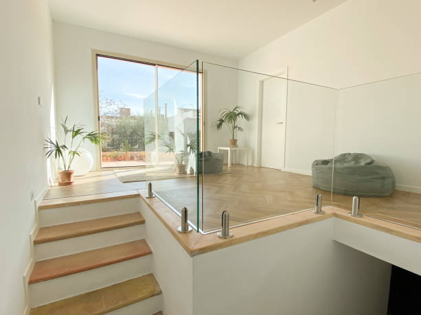 Bright living room Bright living room with plants and confortable poufs house railing stock pictures, royalty-free photos & images