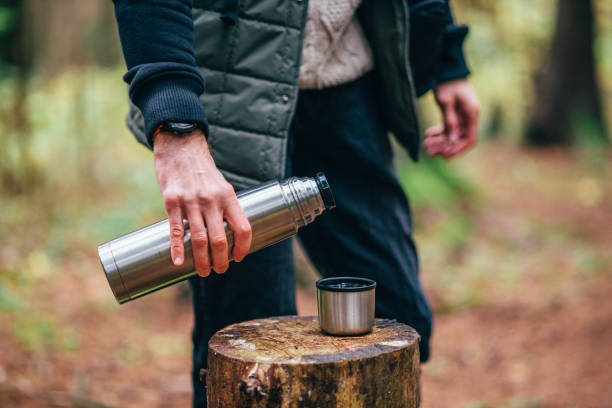 istock Hiker pouring hot drink 1285284515
