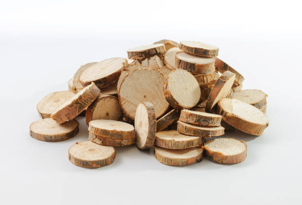 istock Stack of many little round pieces of sawn pine branches 1285284564