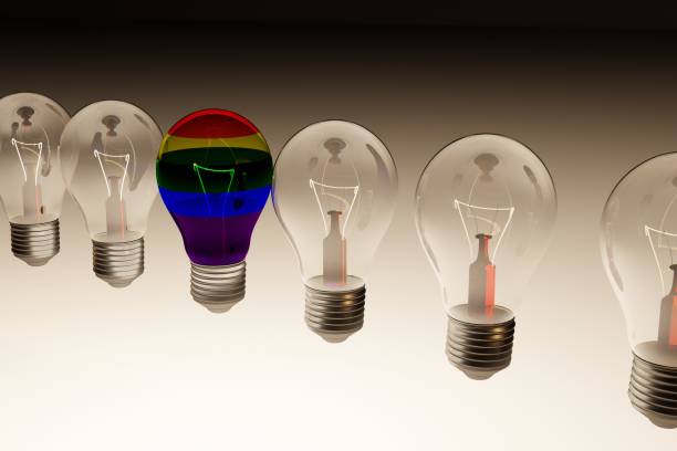 istock LGBT rainbow flag light bulb among regular light bulbs. 1285286585