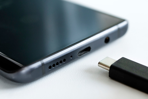 USB Type-C. usb-c cable and smartphone. close-up macro photography