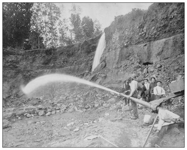 Antique black and white photo of the United States: Hydraulic Gold Mining Antique black and white photo of the United States: Hydraulic Gold Mining panning for gold photos stock illustrations