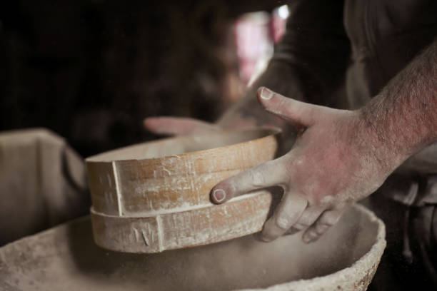 istock sifting homemade flour made on stone 1285288697