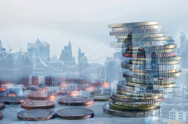 istock double exposure of city with row of coin stack with growth chart and graph progress report for business investment finance banking and money saving concept. 1285293003
