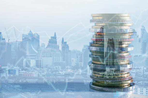 istock double exposure of city with row of coin stack with growth chart and graph progress report for business investment finance banking and money saving concept. 1285293015