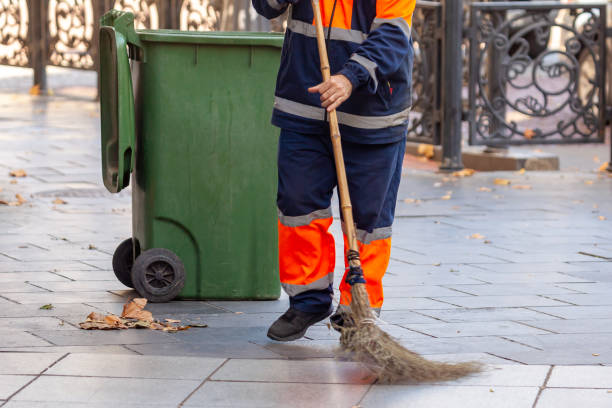 istock Janitor works in the street with a broom 1285293453