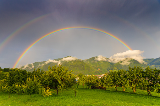 Beautiful rainbow with clouds and blue sky