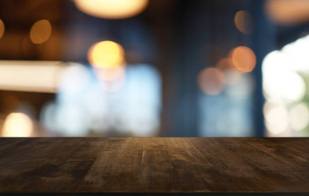 istock Wood Table Top in Blur Background room interior with empty copy space. 1285295337
